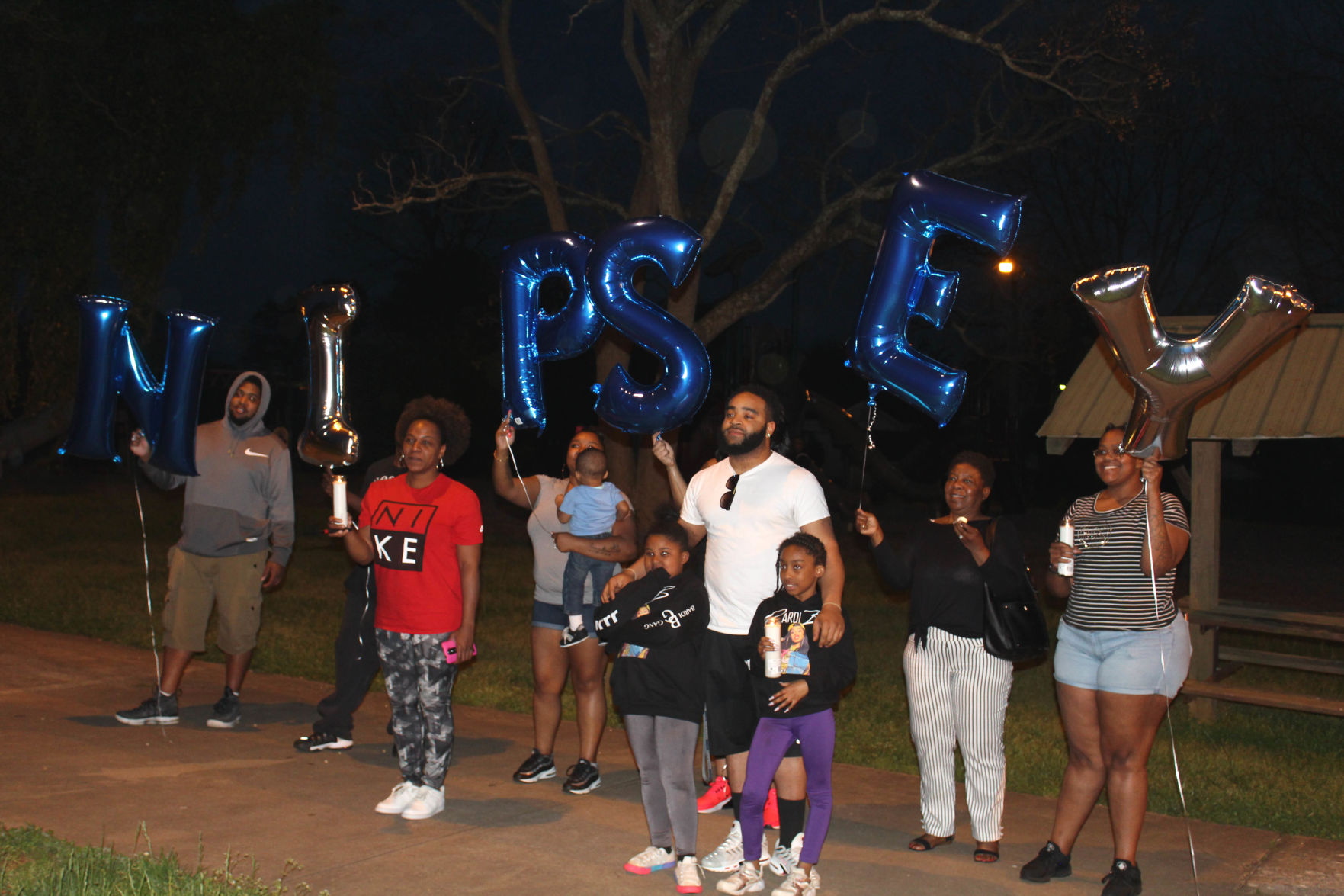 Candlelight vigil inspired by slain rapper remembers local homicide victims